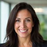 Portrait of Dr. Elara Vance, CEO of Caldera Flux, smiling confidently.