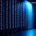 Server racks operating during a power outage, illuminated by backup power light